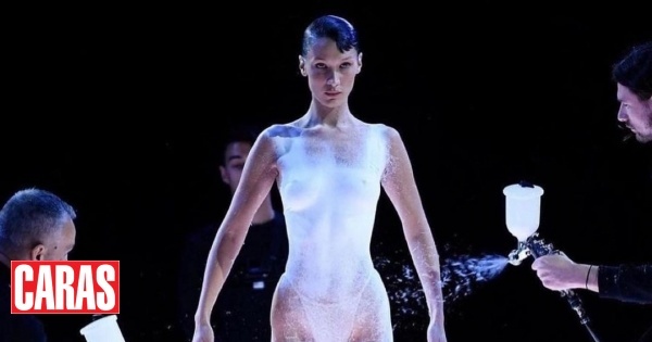 Bella Hadid surprises by parading in spray-painted dress