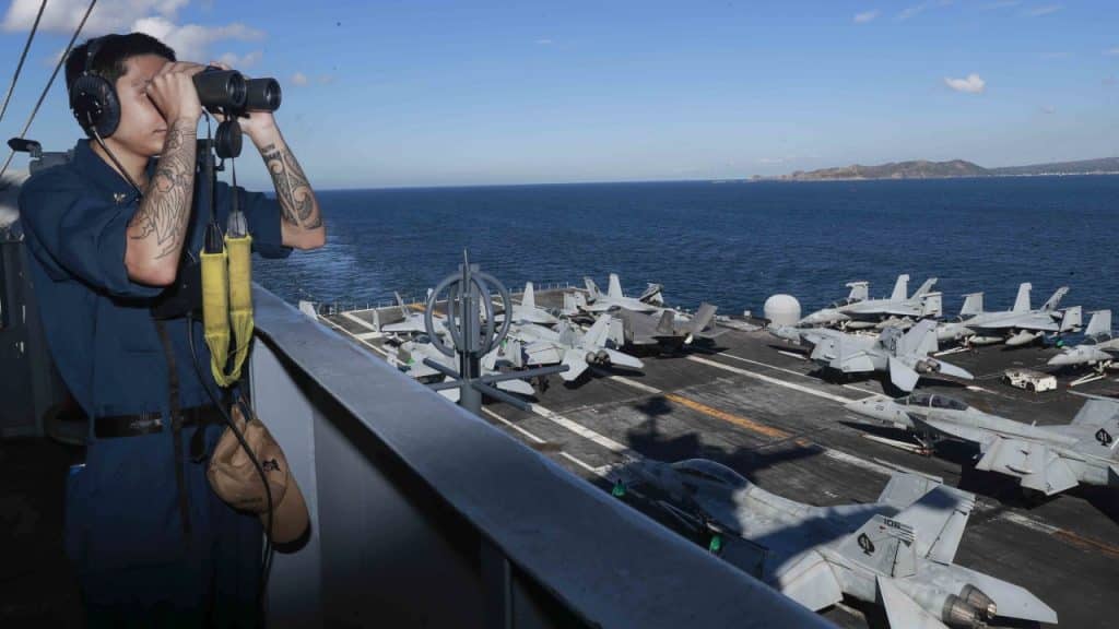 What was the cause of the series of drinking water poisonings on US Navy aircraft carriers?